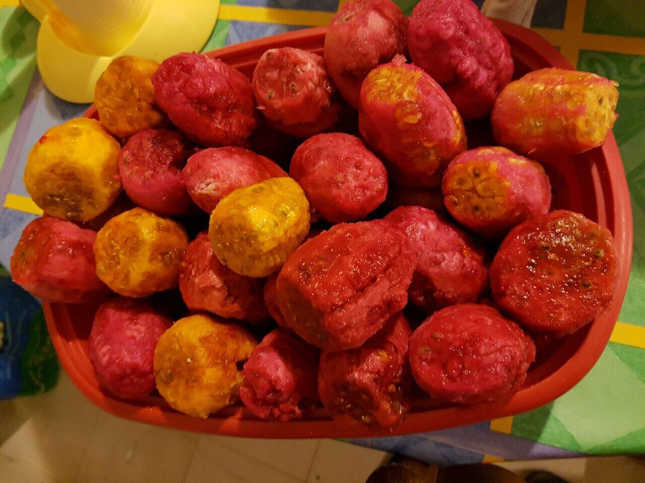 Bowl of red and orange prickly pear fruits